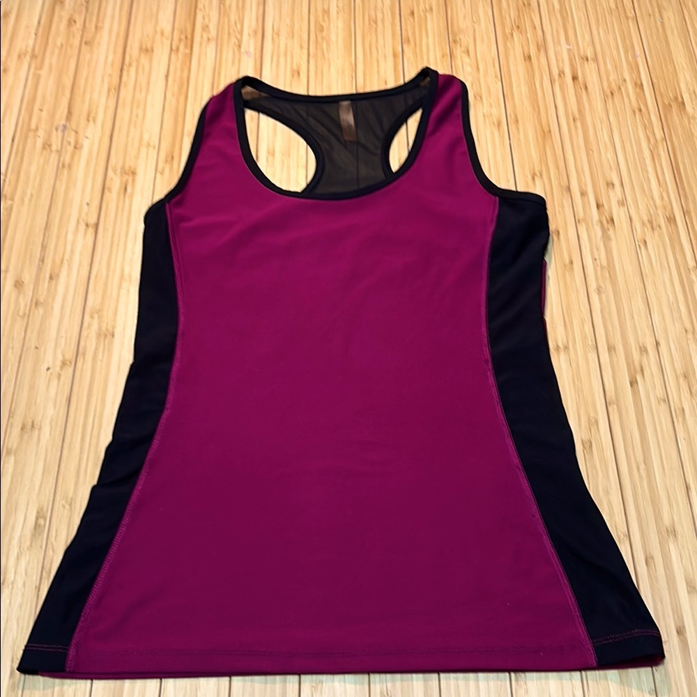 Size XS black and brandy tank with mesh back accent.